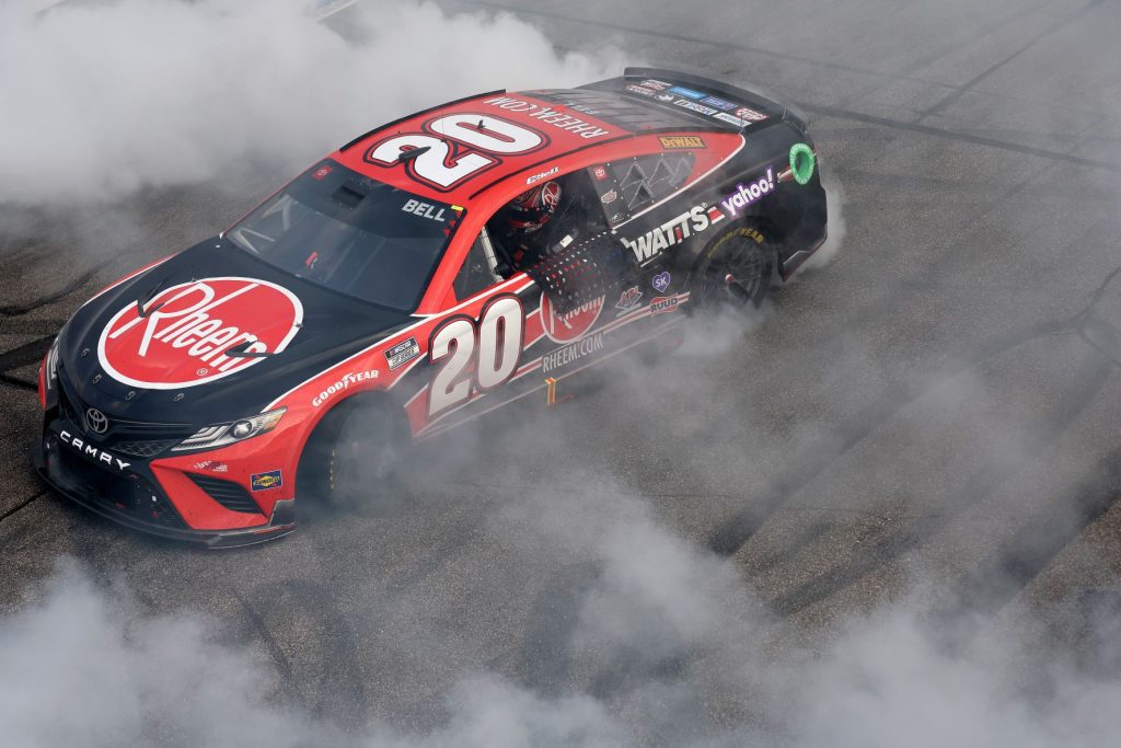 Christopher Bell, driver of the #20 Rheem/WATTS Toyota, celebrates with a burnout after winning the NASCAR Cup Series Ambetter 301 at New Hampshire Motor Speedway on July 17, 2022 in Loudon, New Hampshire. (Photo by James Gilbert/Getty Images)