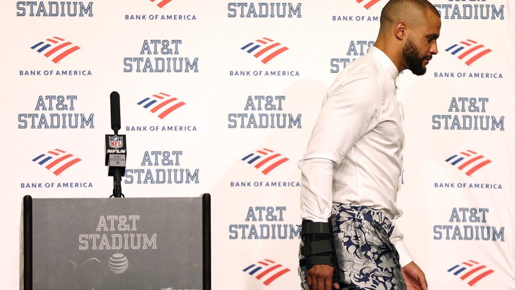 Quarterback Dak Prescott, #4 of the Dallas Cowboys, walks away from the podium during the post-game press conference after a 19-3 loss against the Tampa Bay Buccaneers at AT&amp;T Stadium on Sept. 11, 2022 in Arlington, Texas. Prescott left the game with a hand injury in the fourth quarter.